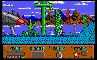 The opening of level 1: the family ship parked at the left, Cosmo standing in the grass, and the status bar showing score, health, bombs and stars